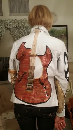 Leather guitar jacket,saxaphone,trumpet, keys