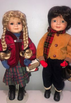 Porcelain doll matching boy and girl holding ice skates