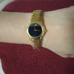 Movado 87 E4 1852 Yellow Gold Plated Women Wristwatch Black Dial 25mm. 
Movado Museum
Women’s Watch 87.E4.1852