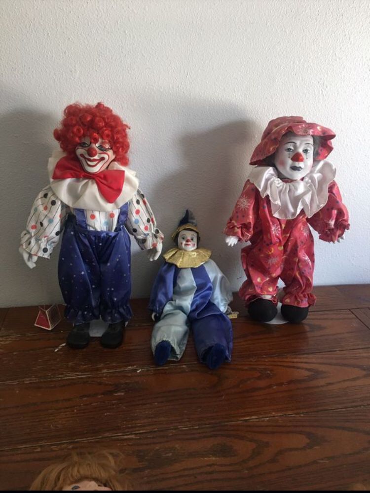 Porcelain clowns. —Dynasty dolls 20 each. All for 50. Collectible. $40’each online Sitting clown is wind up musical