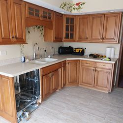 Kitchen cabinets, countertop, and sink