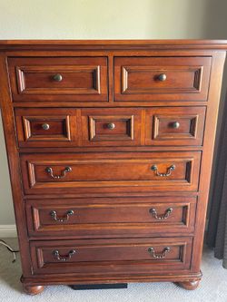Tall wood dresser