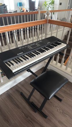 Alesis keyboard with headphones and stool