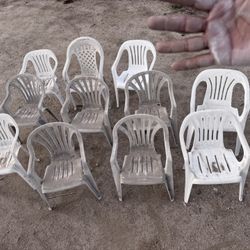 11 chalky / dusty plastic chairs as is