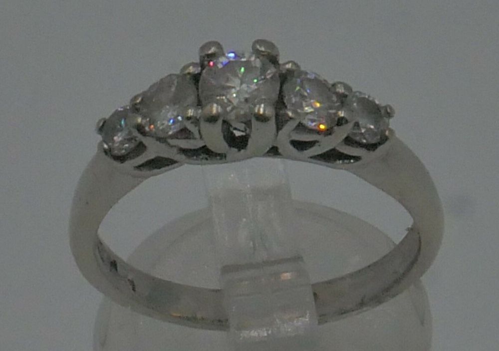 14KT WHITE GOLD ANNIVERSARY BAND SIZE 7.5 3.8 GRAMS WITH 5 DIAMONDS APPROXIMATE - CENTER ROUND DIAMOND 0.30-0.35PTS SI2-H; 2 SIDE DIAMONDS 0.16-0.18