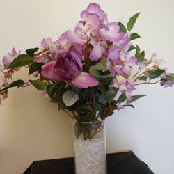 Purple Flowers In A Cylinder Vase