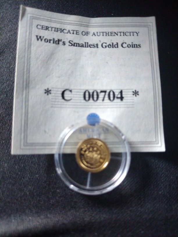 American Mint World Smallest  Gold Coin