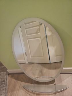 Oval designer mirror with shelf