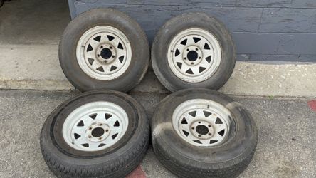 Wagon wheel style 14-inch steel wheels with old tires 5 on 4.5 lugs ford, Toyota, trailer