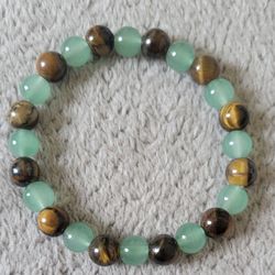 Stretch beaded bracelet crafted from two specific gemstones: Green Aventurine and Tiger's Eye. New.