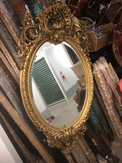Ornate gold antique mirror