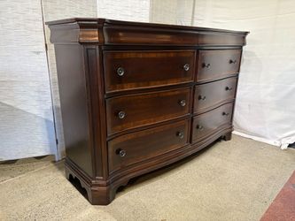 Curved Front 8-Drawer Dresser in Dark Wood Finish