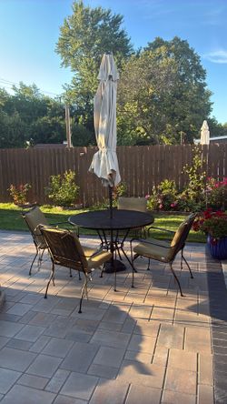 Patio set of 4 chairs and umbrella new paint