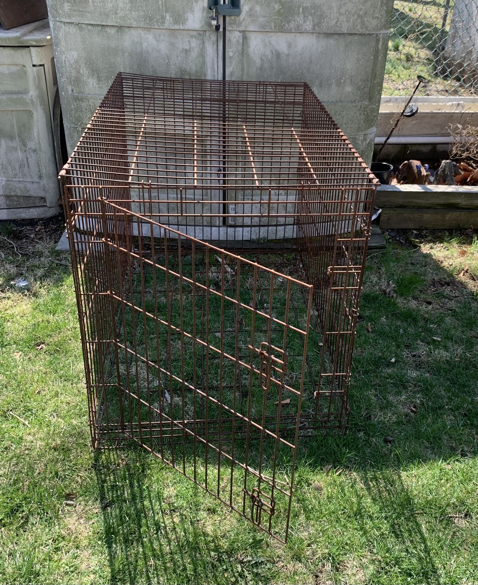 Wire Metal Crate Foldable Rusty Size 42-in L x 28-in W x 32-in H 32 door opening 21x25 was used to keep plants in to keep critters from eating them