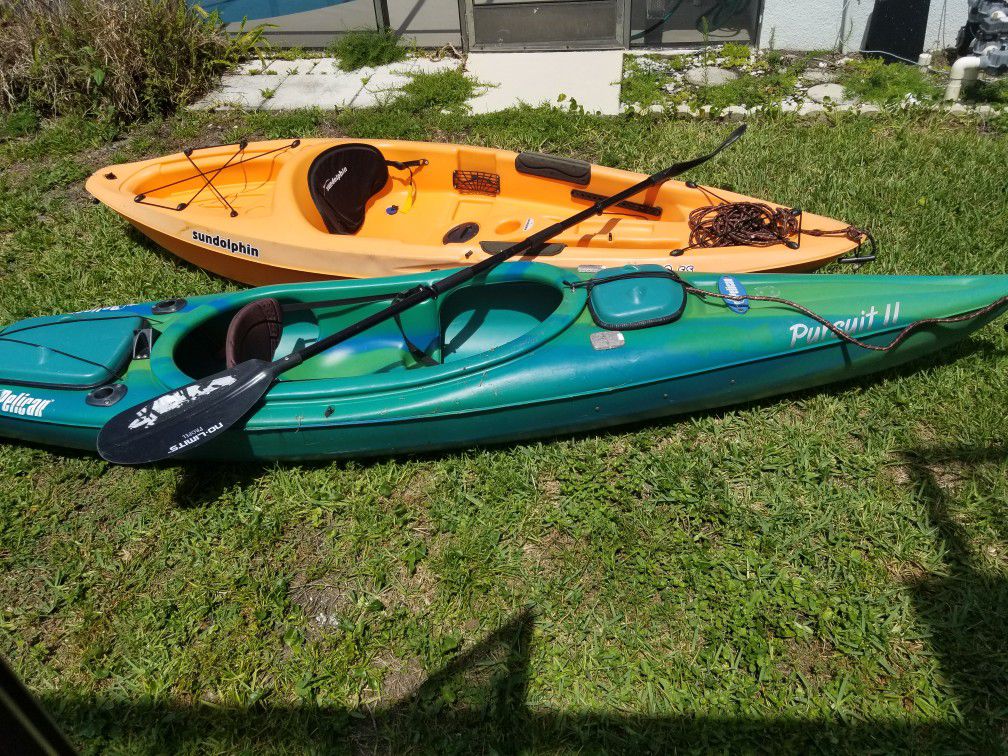Two used kyaks with paddles and life vests $250