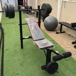 Gym Equipmentt bench press with 100lb weight set