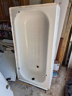 Free steel tub for scrap or repair. Enamel is chipped.
