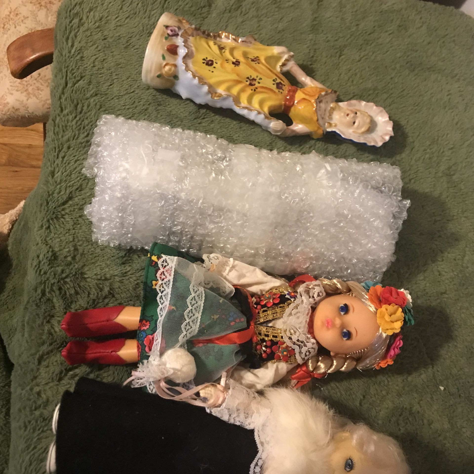 random pile of porcelain and plastic dolls