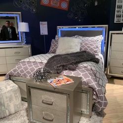 Lonnix Silver LED Upholstered Panel Bedroom Set (Queen and King Bed