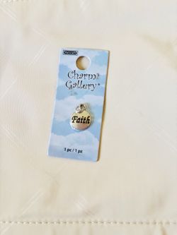 Charm/pendant faith faux silver . New. Comes from a smoke free environment.