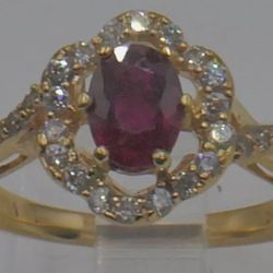   LEVIAN 14KT YELLOW GOLD RING SIZE 7 3.7 GRAMS WITH RUBY 6.7MM X 4.9 MM X 3.2 MM  HAS SOME  SCRATCHES AND UNPERFECTIONS AND 18 DIAMONDS 2.5 PTS SI1 G
