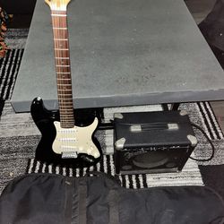 Electric Guitar with Medium Sized Amp