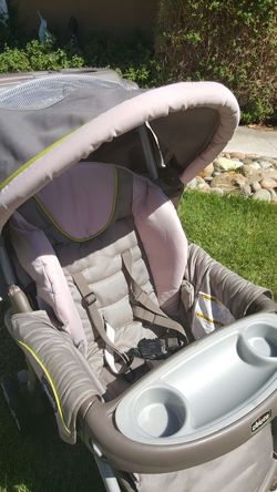 Chicco Baby stroller. ..girls tan and pink color..tons of storage. ...folds up...great condition!