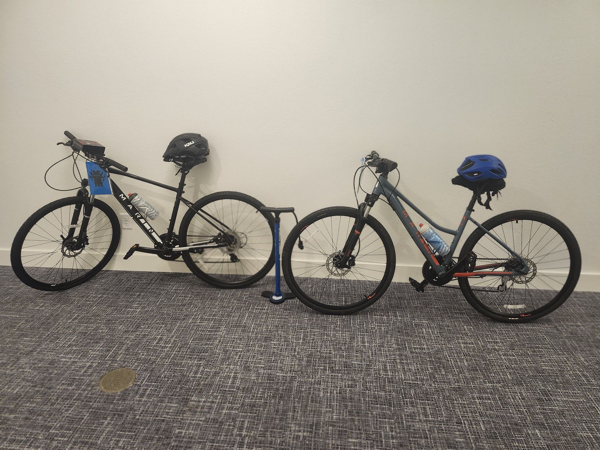 Two like-new Marin hybrid bikes with helmets, pump, and bike rack included. Ready to ride!