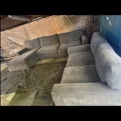 Big oversize gray couch with matching loveseat good condition clean we sell all the time free delivery