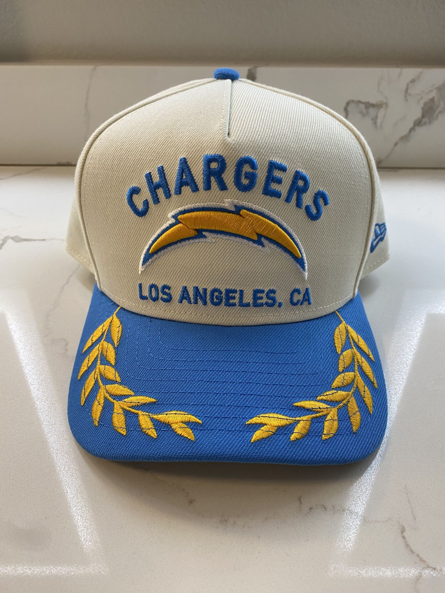 Item listed is a brand new, never worn “Los Angeles Chargers” snapback by All The Glory.
