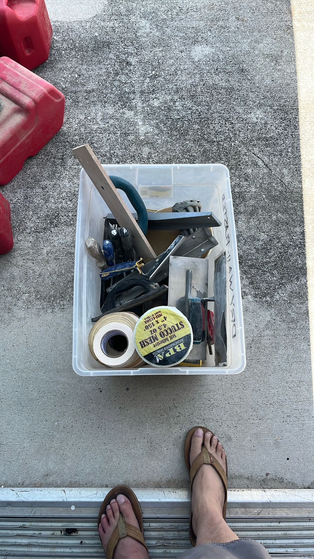 Box full of tile and drywall tools
