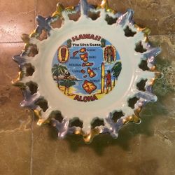 This item is a vintage Hawaii "The 50th State" souvenir decorative plate, likely from the 1960s or 1970s.     
