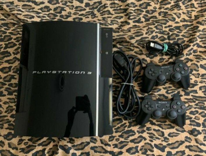PS3 Fat with 2 controllers and games