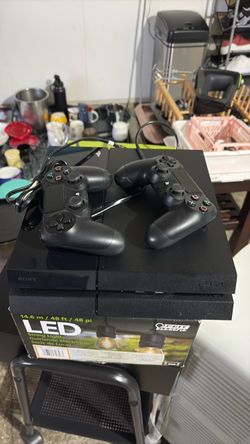 Sony PlayStation 4 Console with Two Controllers