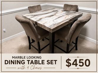 Modern dining table set with marble-look top and 4 matching padded chairs.