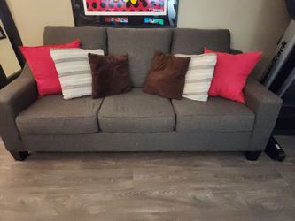 Gray sofa with pillows