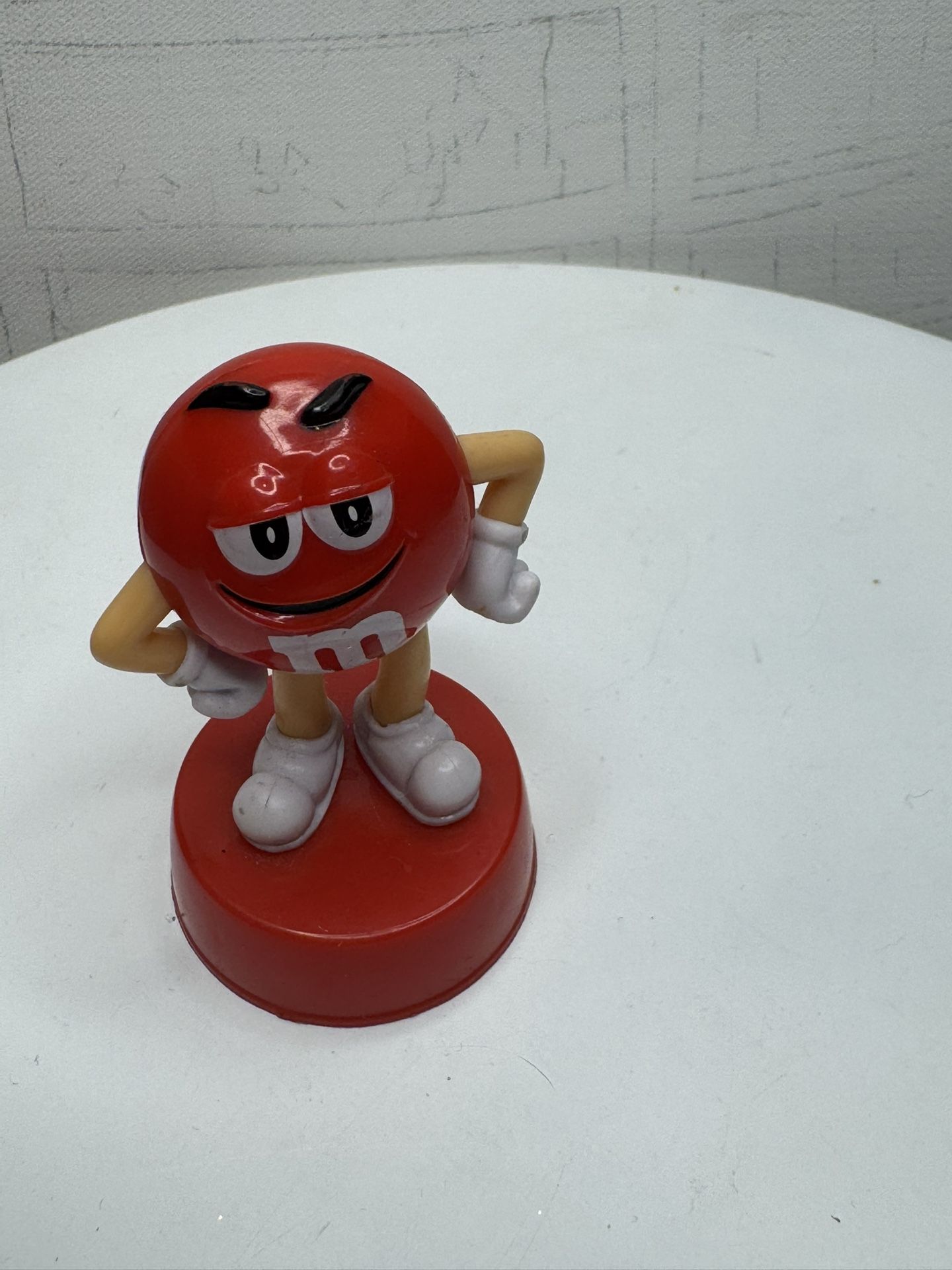 Collectible figurine of the Red M&M's character.