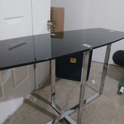 BLACK GLASS N CHROME TABLE..