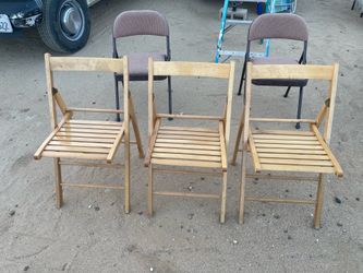 Three vintage wood folding chairs