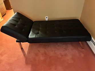Tufted chaise with reclining back