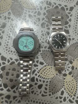 baby blue dial patek and silver watch