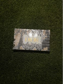 Christian Dior limited-edition holiday presentation gift box featuring an intricate black, white, and gold botanical illustration by artist Pietro Ruf