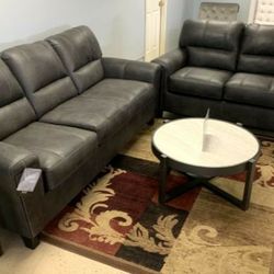 Grayish Brown Faux Leather sofa and loveseat $10 down leasing