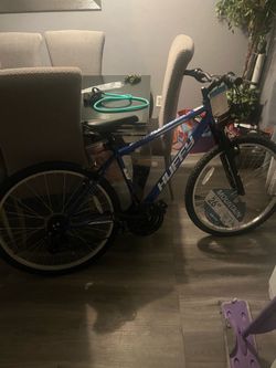 Blue Huffy Mountain Bike (Tires slightly flat need to be pumped)