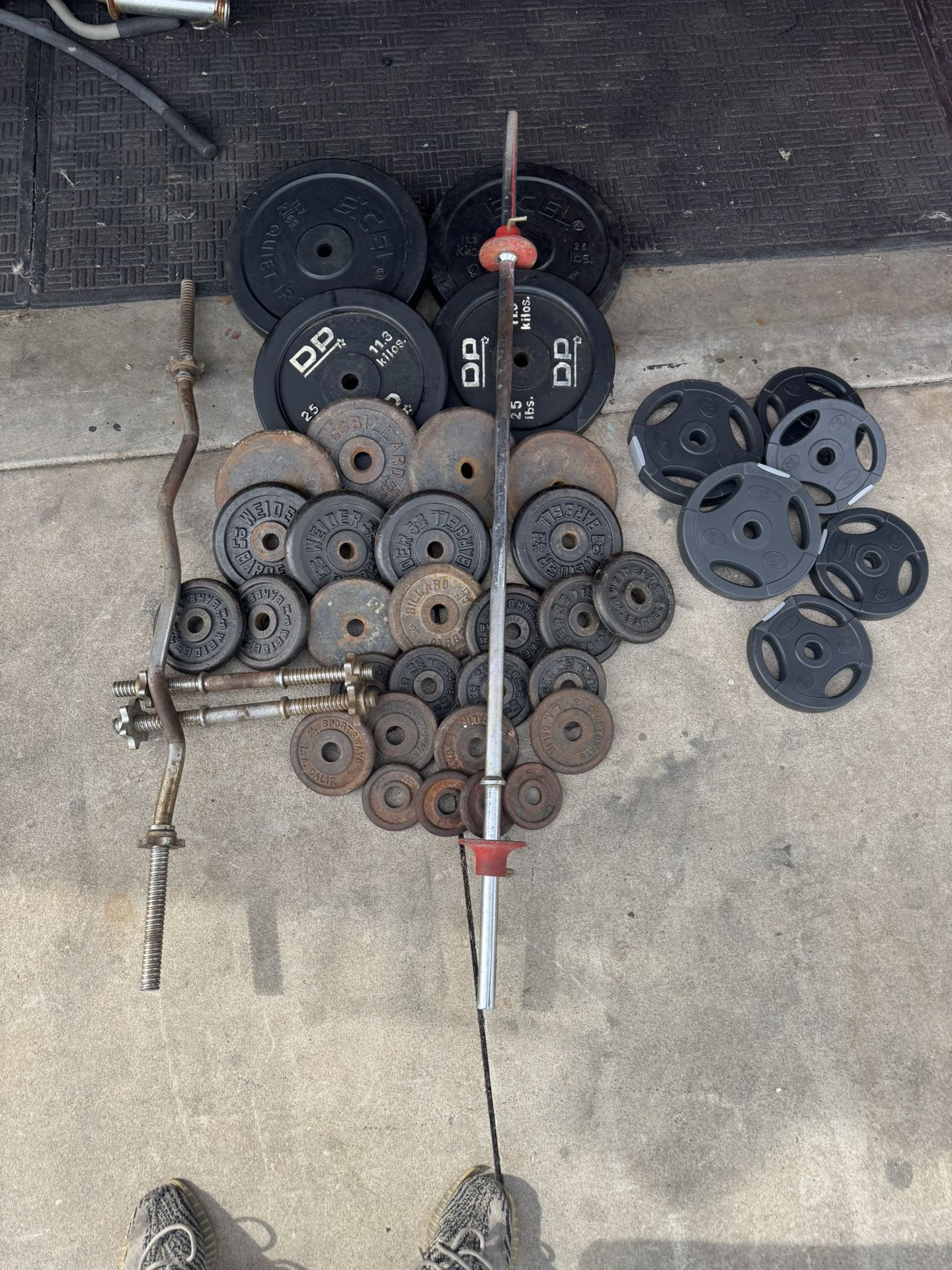 Standard weights 280lbs total plus curl bar and 5ft bar plus adjustable dumbbells