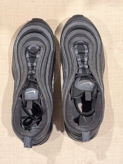The Nike Air Max 97 Men's Black Low Top Lace Up Sneakers with a Rubber Outsole are a stylish and comfortable choice for athletic and casual occasions.