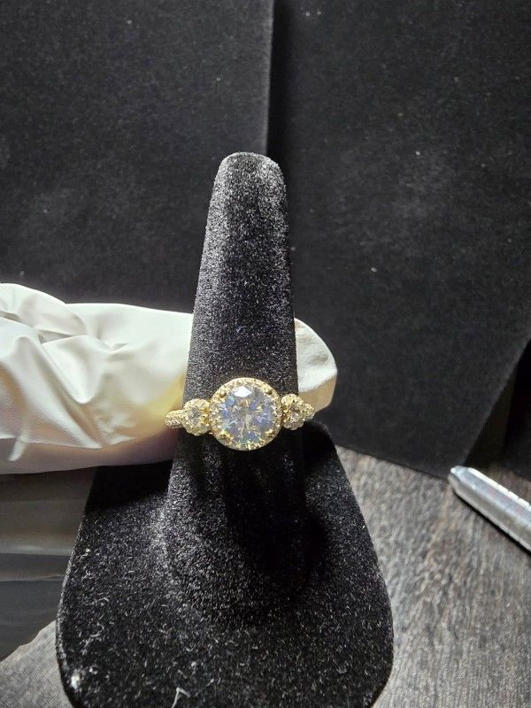 The product is a stunning 10kt gold over 925 silver size 6 ring diamond 
