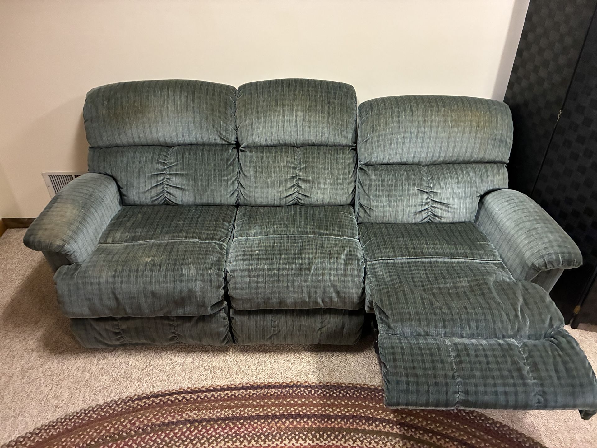 Three Seat Couch 1-side Reclines. 