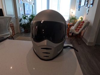 Silver full-face motorcycle helmet