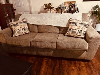 2 Ashley sofas sat on only a few times